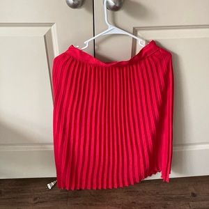 Red pleated midi skirt